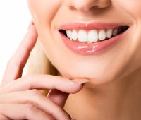 cropped-view-of-smiling-woman-with-white-teeth-iso-TU3C8F3-scaled